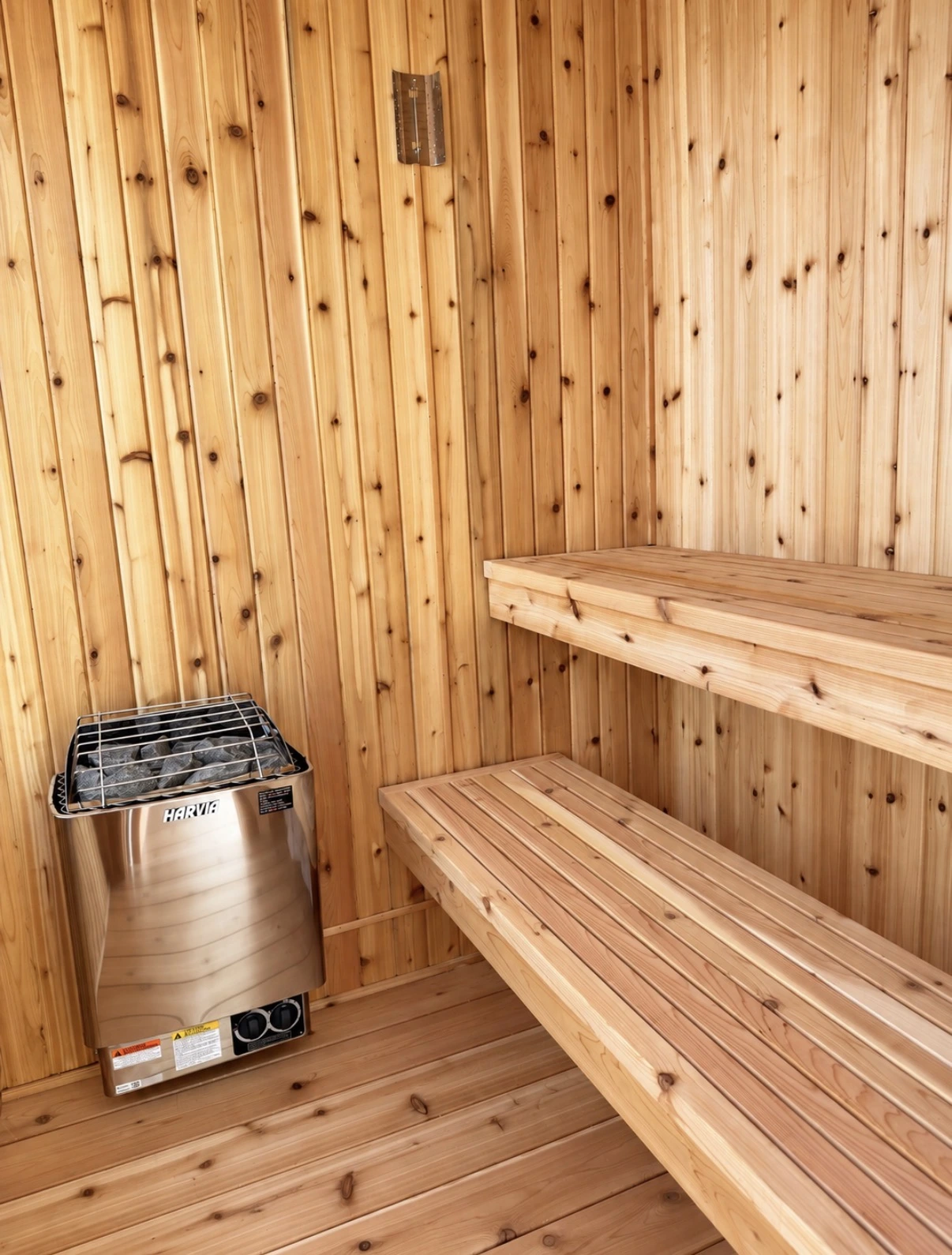 Badrock cedar interior with two-tier benches and an electric sauna heater